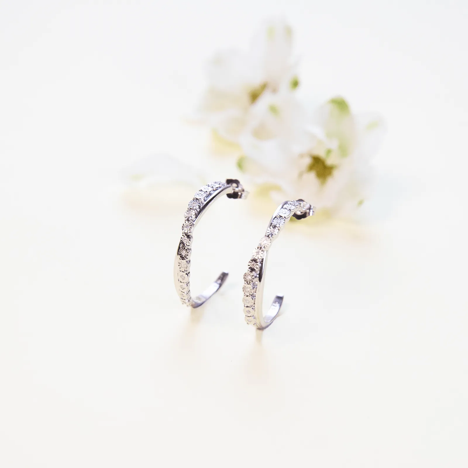 Brilliant 0.08ct Diamond Crossover Hoop Earrings in Sterling Silver