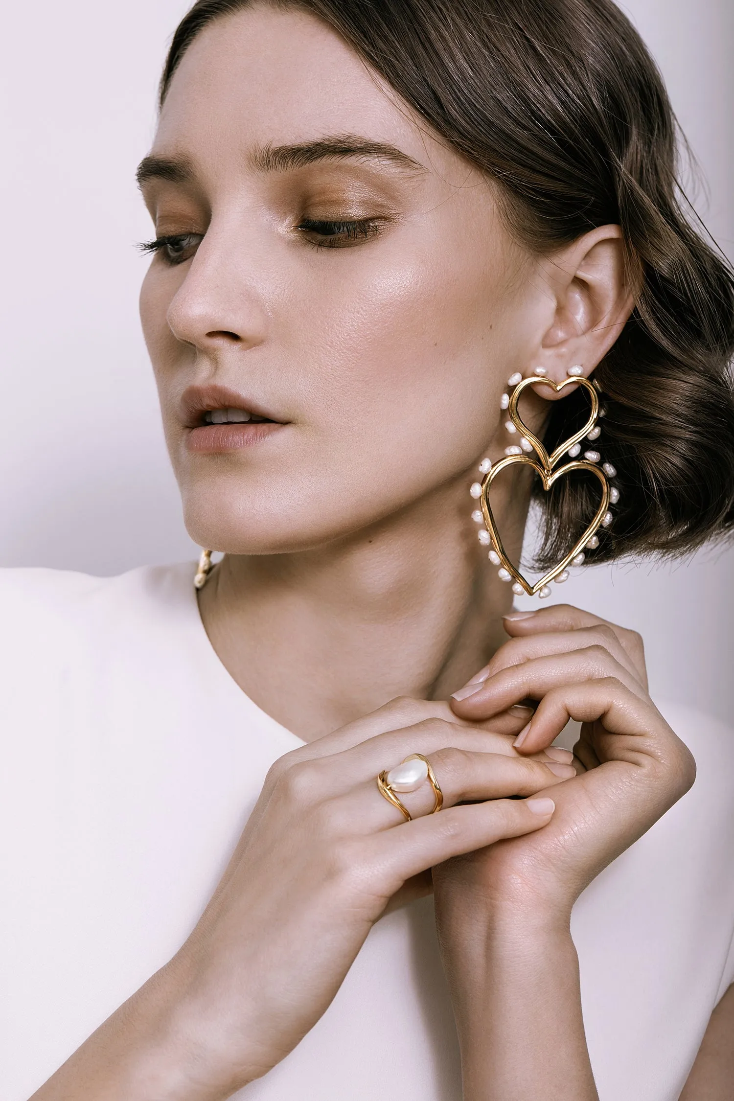 DOUBLE HEART STATEMENT PEARL EARRINGS