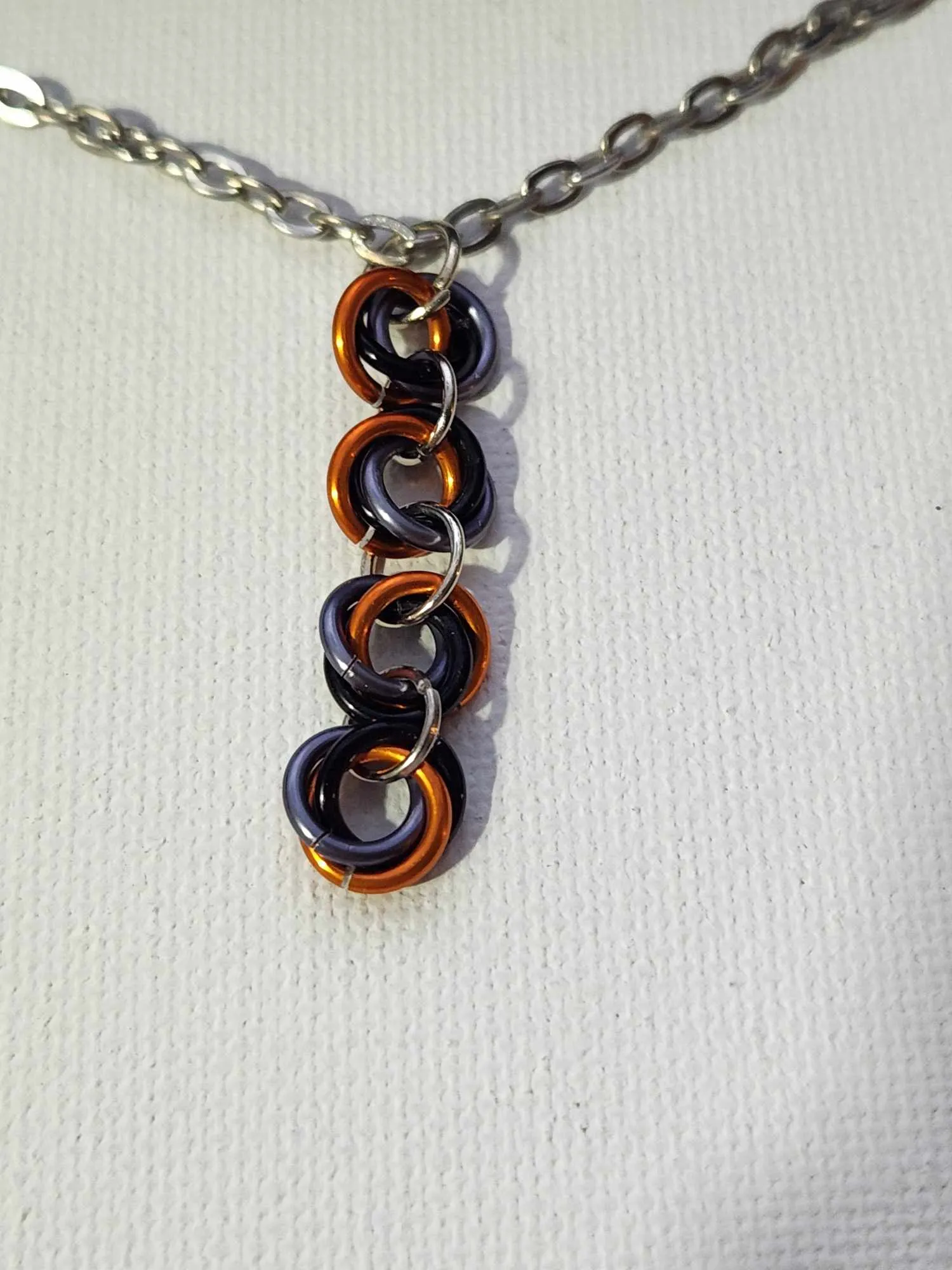 Spiked or Not Spiked Orange, Gray and Black Mobius Necklaces